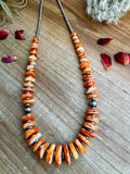 22 Inch orange spiny, hematite and sterling silver pearls